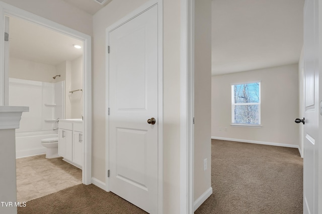 hallway with light carpet