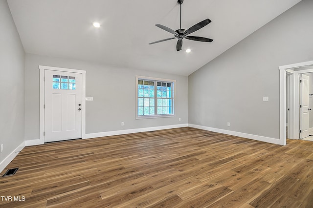 foyer entrance featuring hardwood / wood-style floors, ceiling fan, and high vaulted ceiling