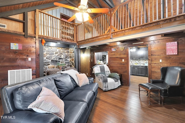 living room featuring wooden walls, high vaulted ceiling, wood ceiling, and hardwood / wood-style flooring