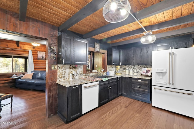 kitchen with beamed ceiling, white appliances, tasteful backsplash, and light hardwood / wood-style floors