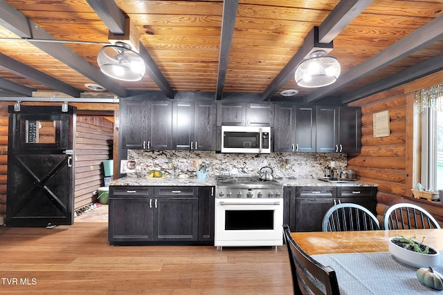 kitchen with backsplash, light stone countertops, rustic walls, stainless steel range, and beam ceiling