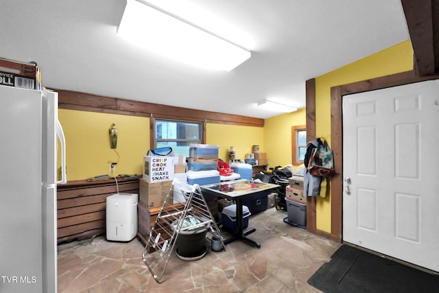 basement with white fridge