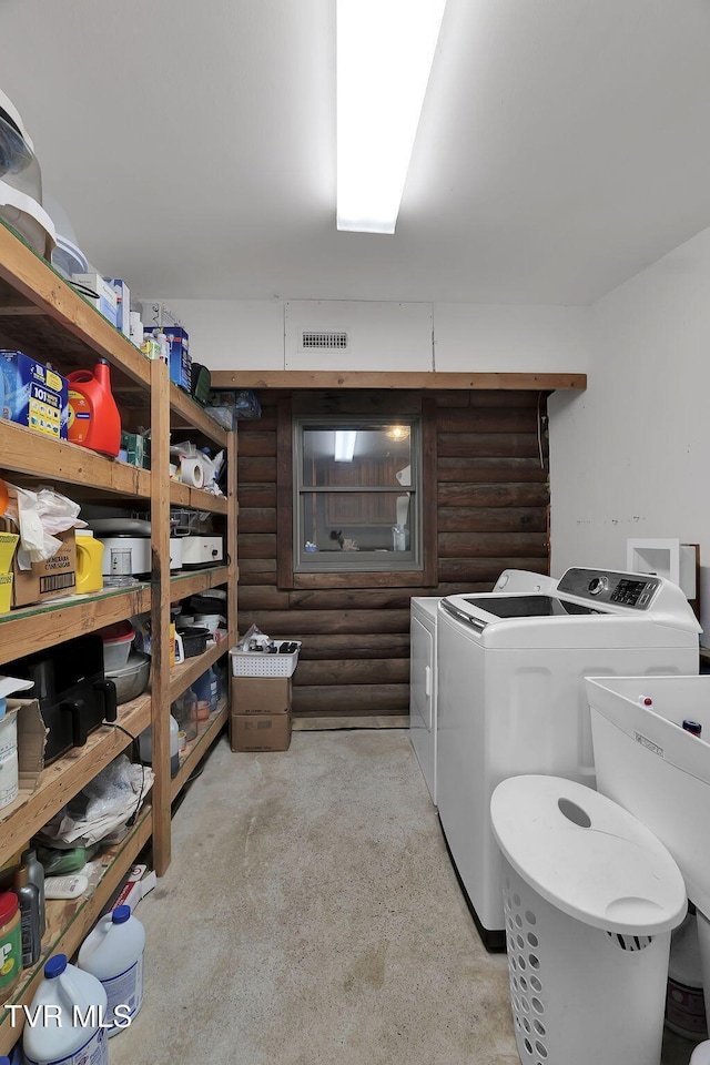 laundry area with sink and washing machine and clothes dryer