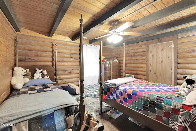 bedroom featuring ceiling fan, beam ceiling, wood ceiling, and rustic walls