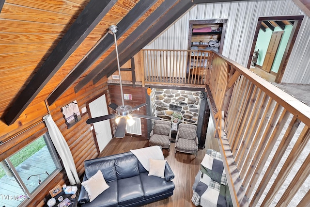 living room with wood-type flooring, vaulted ceiling with beams, ceiling fan, and wood ceiling