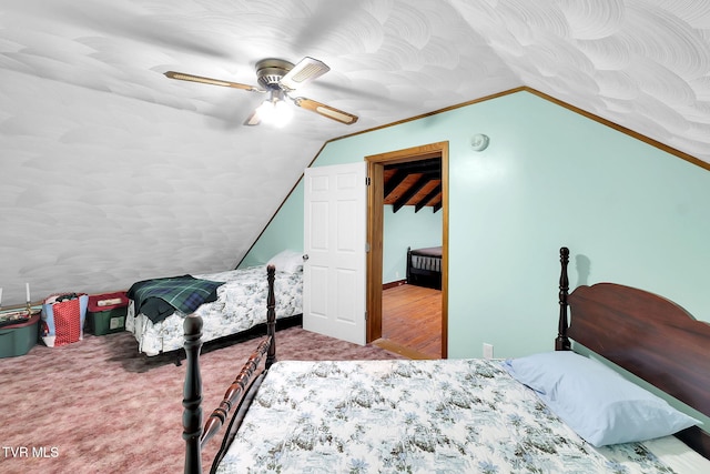 carpeted bedroom featuring vaulted ceiling and ceiling fan