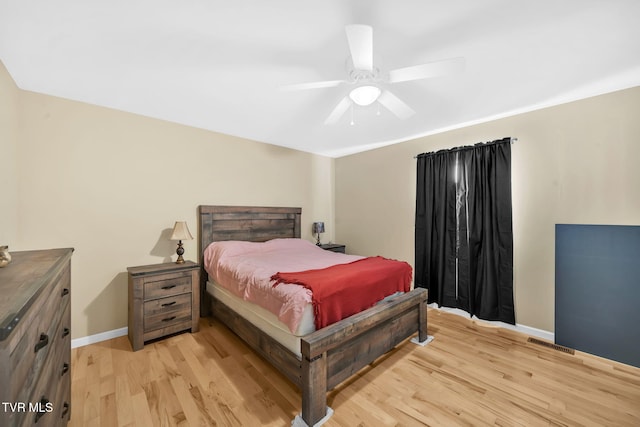 bedroom featuring ceiling fan and light hardwood / wood-style floors