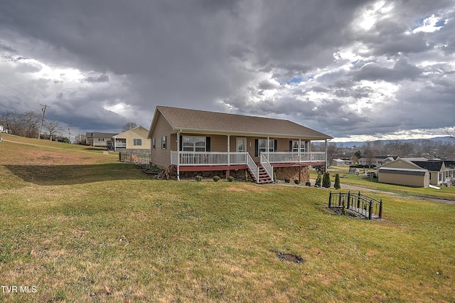 view of front of home with covered porch and a front yard