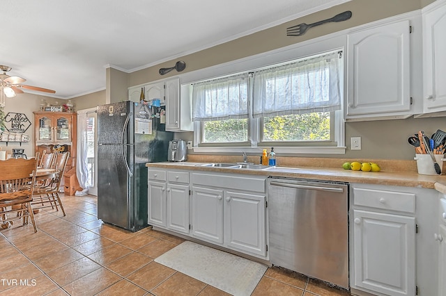 kitchen featuring dishwasher, black refrigerator, ceiling fan, light tile patterned floors, and white cabinetry