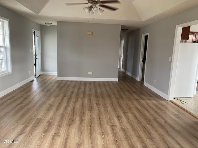 unfurnished room featuring hardwood / wood-style floors, ceiling fan, and lofted ceiling