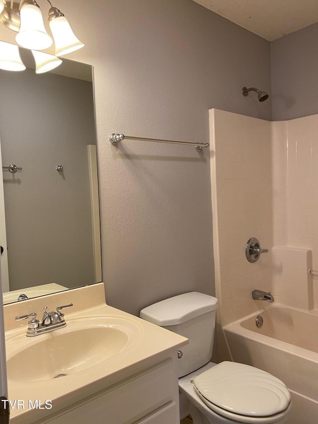 full bathroom featuring vanity, toilet, and shower / tub combination