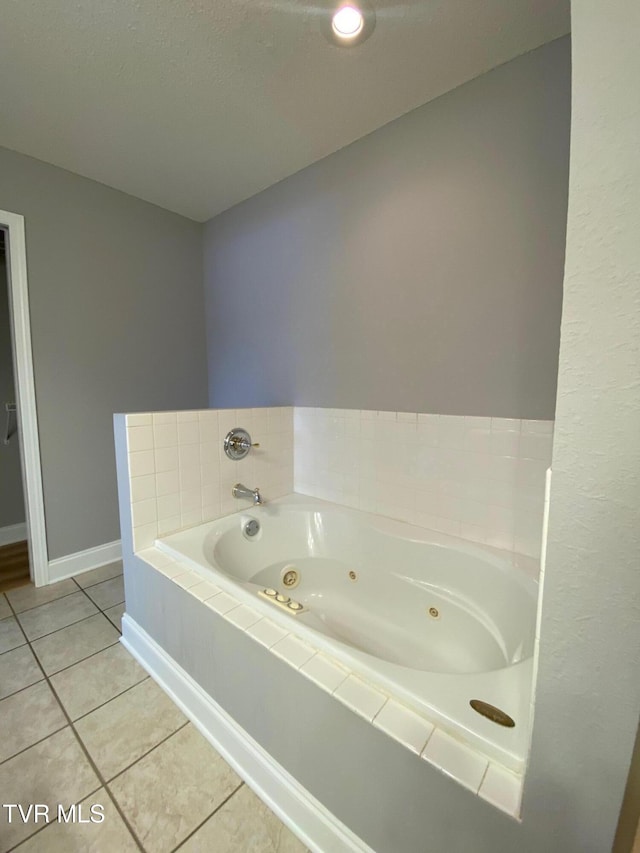 bathroom featuring tile patterned floors and a washtub