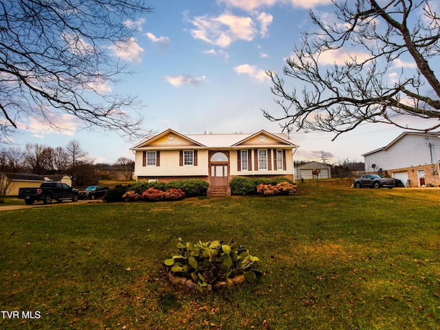 view of front of house with a lawn