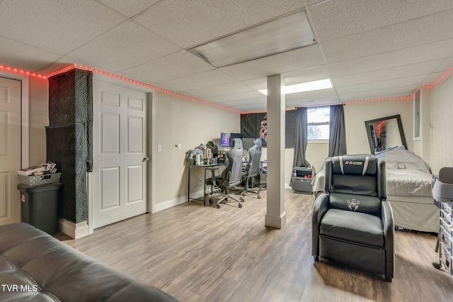 interior space featuring hardwood / wood-style floors and a paneled ceiling