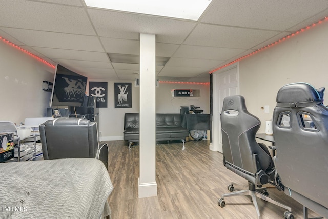 office space featuring a drop ceiling and hardwood / wood-style floors