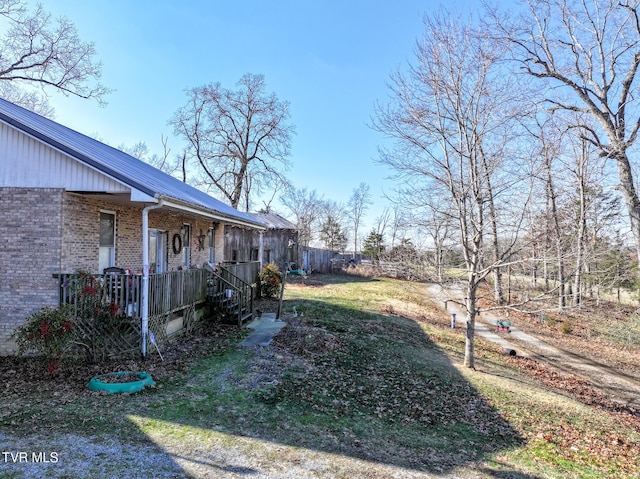 view of yard with covered porch