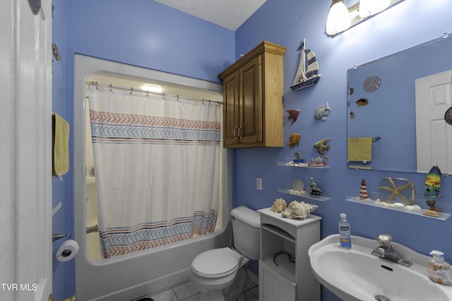 full bathroom featuring tile patterned floors, a textured ceiling, sink, shower / bathtub combination with curtain, and toilet