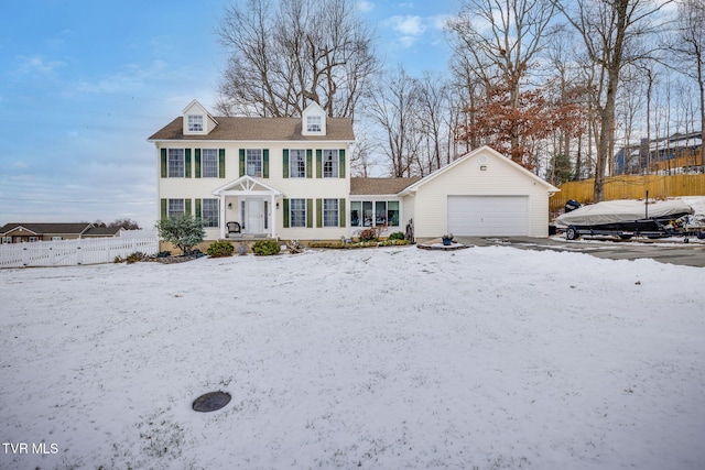 colonial inspired home with a garage