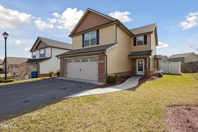 view of front facade featuring a garage, aphalt driveway, fence, a front lawn, and brick siding