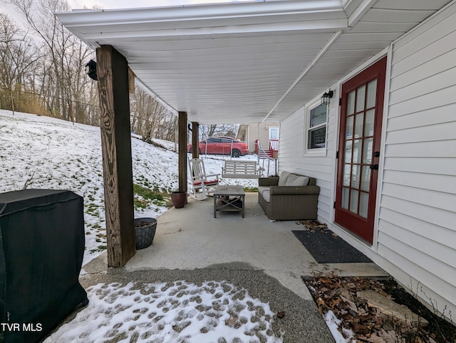 view of snow covered patio