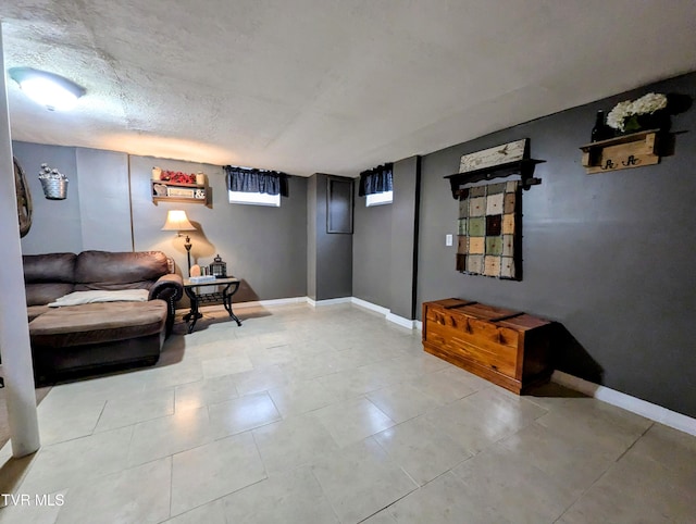 living area featuring a textured ceiling