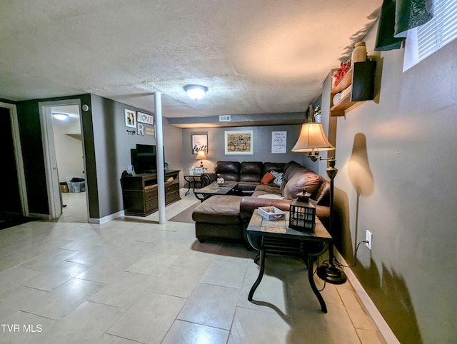 living room featuring a textured ceiling