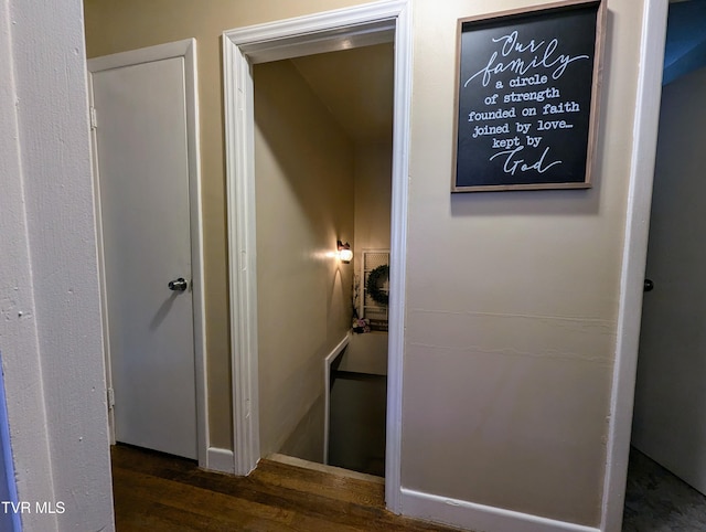 corridor featuring dark wood-type flooring