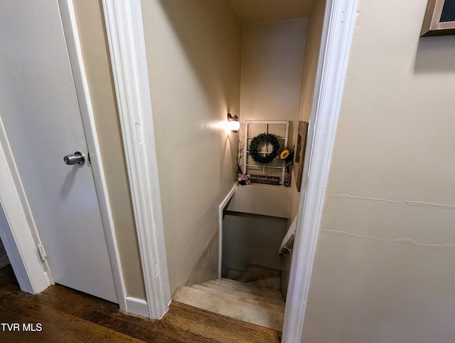 stairs featuring wood-type flooring