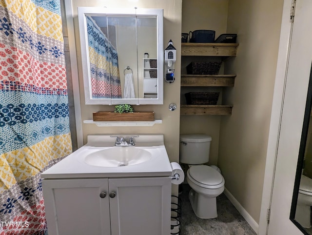 bathroom with toilet and vanity