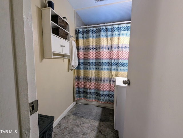 bathroom featuring curtained shower