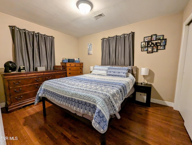 bedroom featuring dark hardwood / wood-style floors