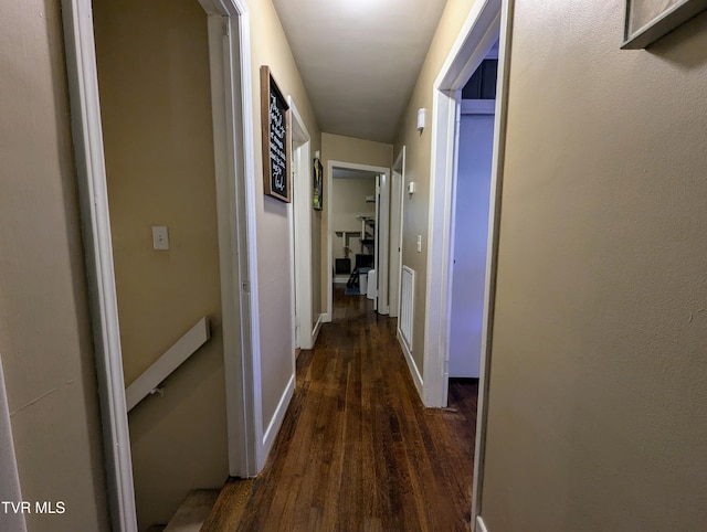 hall with dark hardwood / wood-style flooring