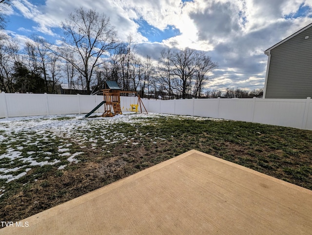 view of yard with a patio and a playground