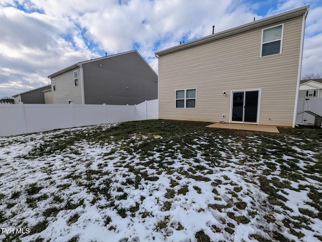 view of snow covered house