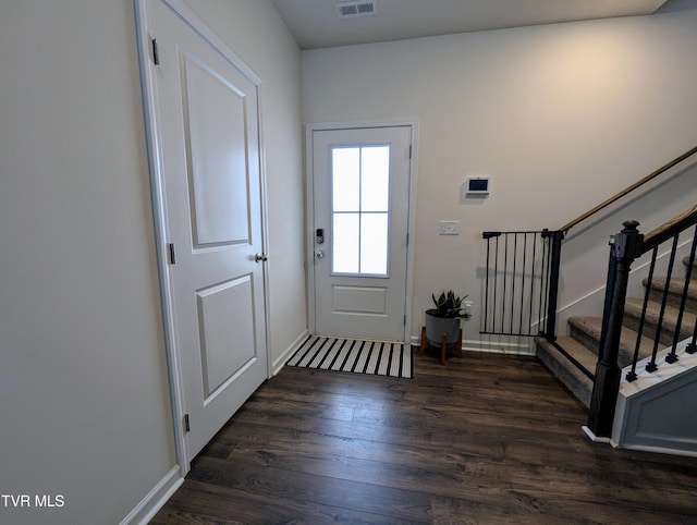 entryway with dark hardwood / wood-style floors