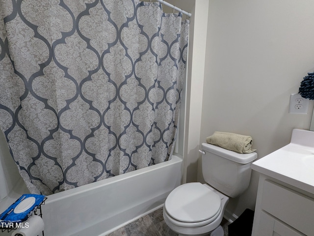 bathroom featuring toilet, vanity, and hardwood / wood-style floors