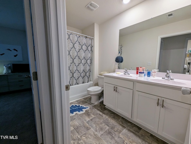 full bathroom featuring toilet, vanity, and shower / bath combination with curtain