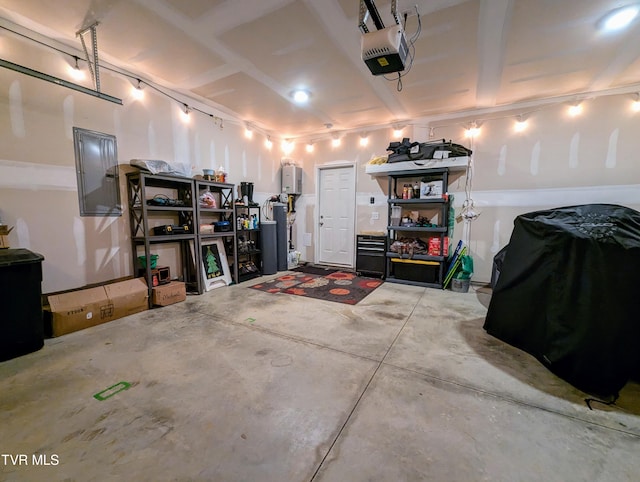 garage with electric panel and a garage door opener