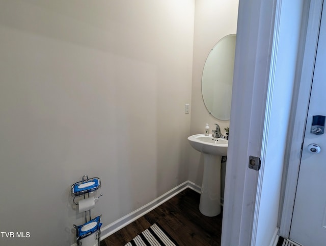 bathroom with hardwood / wood-style floors