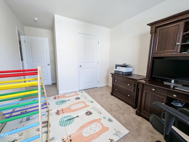 bedroom with light colored carpet