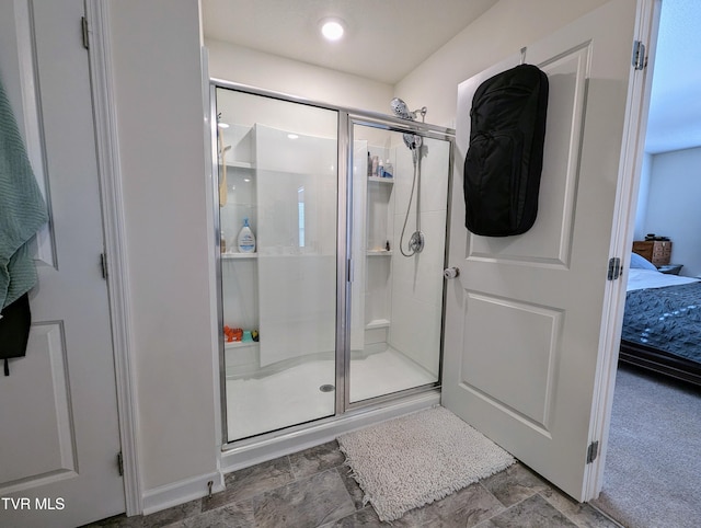 bathroom with a shower with shower door