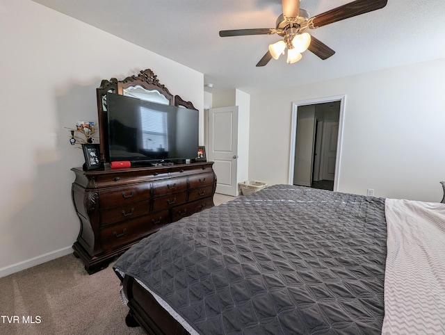 bedroom featuring ceiling fan and carpet