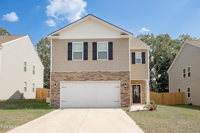 view of front of home with a garage and a front lawn