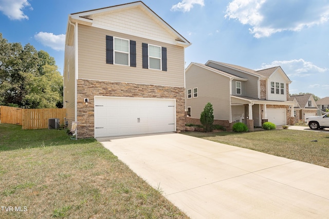 view of front of property featuring a front lawn, a garage, and central AC unit