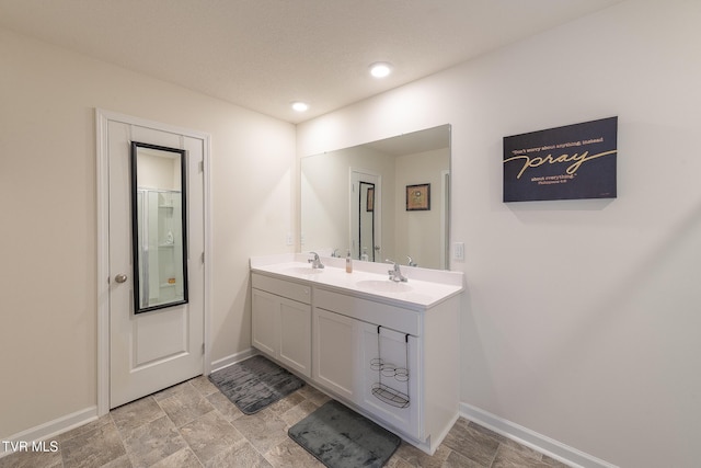 bathroom featuring vanity and a textured ceiling