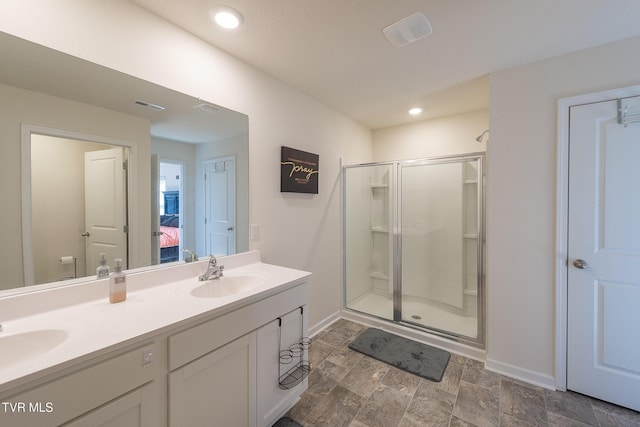 bathroom with vanity and an enclosed shower