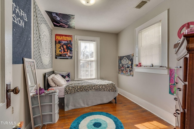 bedroom with hardwood / wood-style flooring