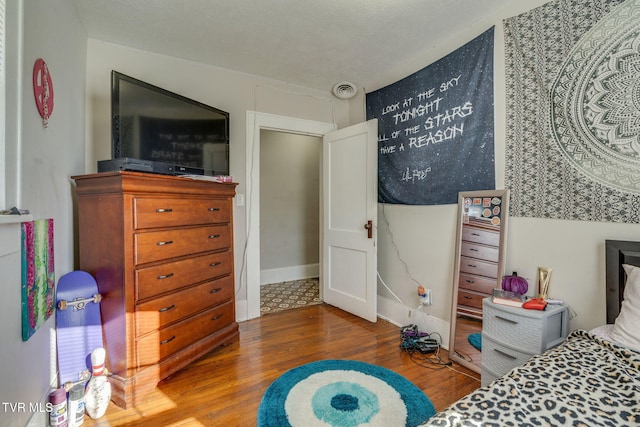 bedroom featuring wood-type flooring