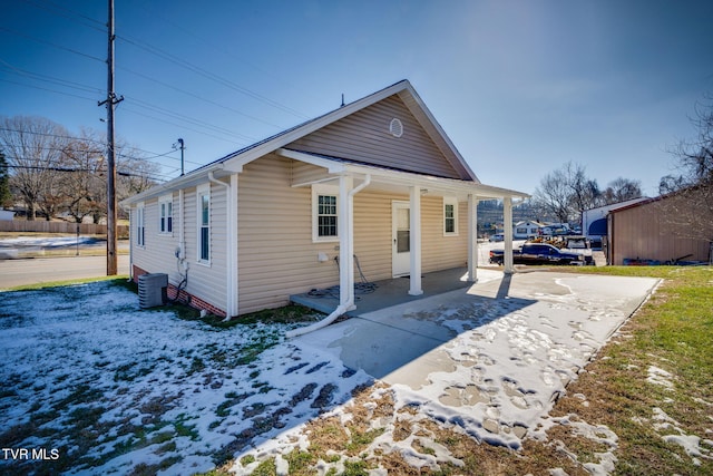 back of house featuring central AC unit