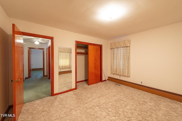 unfurnished bedroom with carpet flooring and a closet